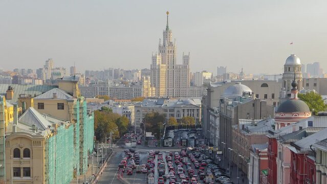 Aerial view of Lubyanskaya and Novaya Square in Moscow timelapse from rooftop in spring day, Russia. Stalin skyscraper on the background