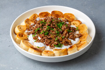 Turkish Manti with Yogurt, Minced Meat and Fried Butter Sauce From Artvin called Silor - Siron - Ziron Rolled Raw Dough and Fried Phyllo -Manlama with Dill