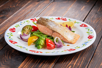 salmon steak with vegetables, top view