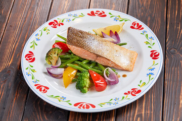 salmon steak with vegetables, top view
