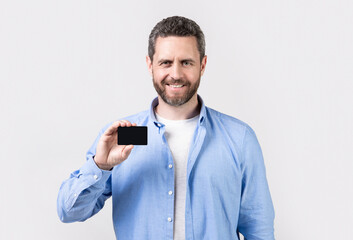 cheerful man show business credit isolated on studio background.