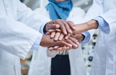 Closeup, hands and group in a hospital, healthcare or scientists with support, motivation or solidarity. Zoom, coworkers or medical professional with teamwork, collaboration or team building in a lab