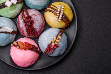 Delicious sweet colorful mochi desserts or ice cream with rice dough and toppings