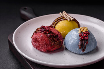 Delicious sweet colorful mochi desserts or ice cream with rice dough and toppings