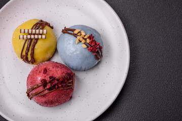 Delicious sweet colorful mochi desserts or ice cream with rice dough and toppings