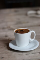 cup of coffee on wooden table