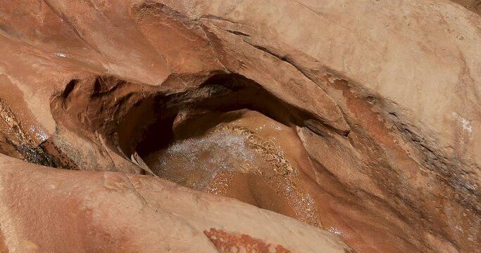 Utah desert rocky river canyon water flow waterfall 4K. Southern Utah recreation hiking exploring. Grand Staircase Escalante National Monument, Willis Creek slot canyon. Wilderness environment.