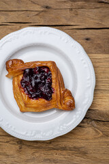 Delicious flavored pastries on a wooden table.  Close up