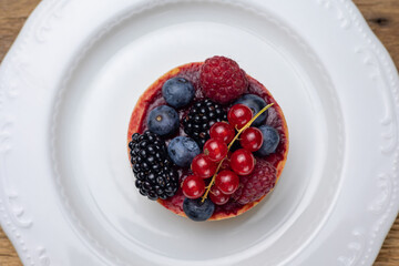 Delicious flavored pastries on a wooden table.  Close up