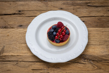 Delicious flavored pastries on a wooden table.  Close up