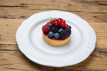Delicious flavored pastries on a wooden table.  Close up