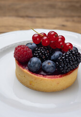 Delicious flavored pastries on a wooden table.  Close up