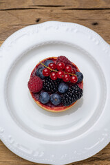 Delicious flavored pastries on a wooden table.  Close up