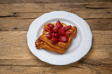 Delicious flavored pastries on a wooden table.  Close up