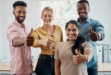 Climbing our way up the business ladder. Cropped portrait of a diverse group of businesspeople standing together and making a thumbs up gesture in the office. - Powered by Adobe