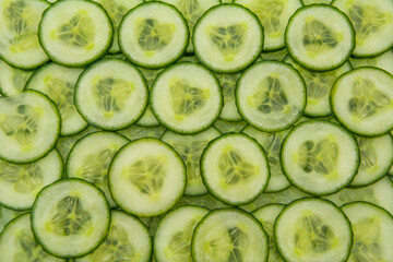 Background covered with cucumber slices