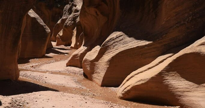 Utah desert rocky river slot canyon 4K. Southern Utah recreation hiking exploring. Grand Staircase Escalante National Monument, Willis Creek slot canyon. Wilderness environment.