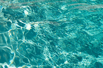Fototapeta na wymiar defocused turquoise ripple pool blured background. photo of defocused turquoise pool