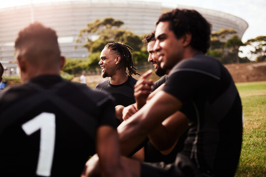 Some of the best talent the rugby world has seen. Shot of a group of young rugby players having a discussion on the field.