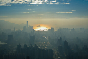 Sunset and a foggy landscape overlooking Hong Kong City harbour