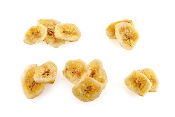 Baked and dried banana chip slice isolated over the white background.   Dried banana slices in high...