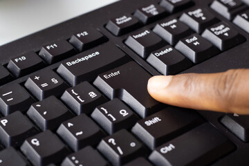 finger typing on a keyboard