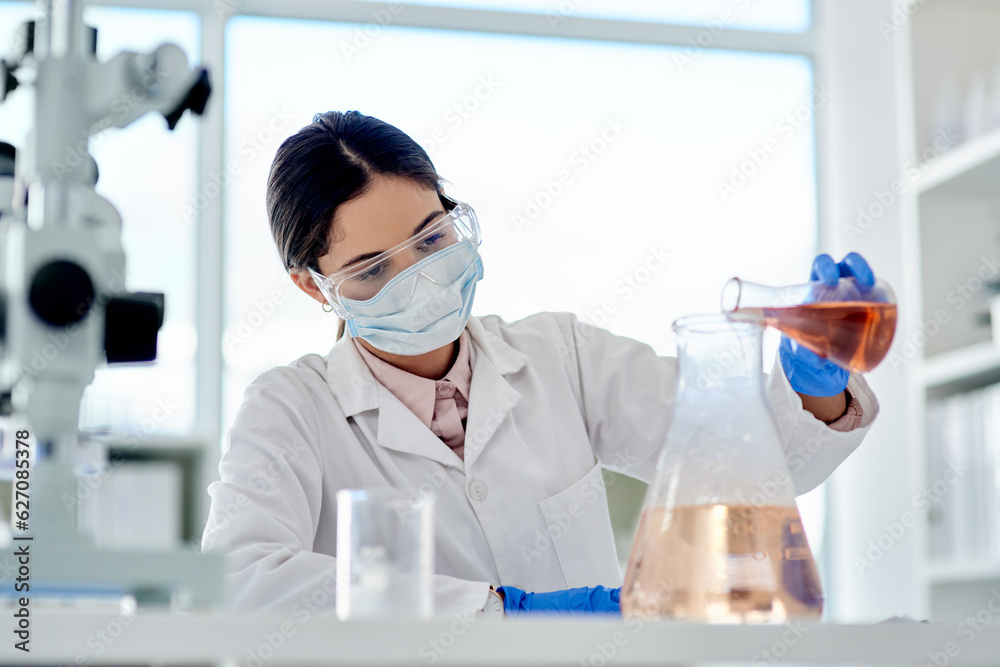 Poster i hope this reacts as i expect it to. shot of a young scientist doing an experiment in a lab.