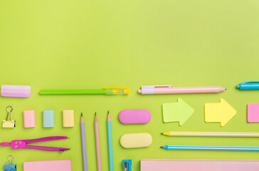 Flat lay with colorful school stationery on color backgroung, top view