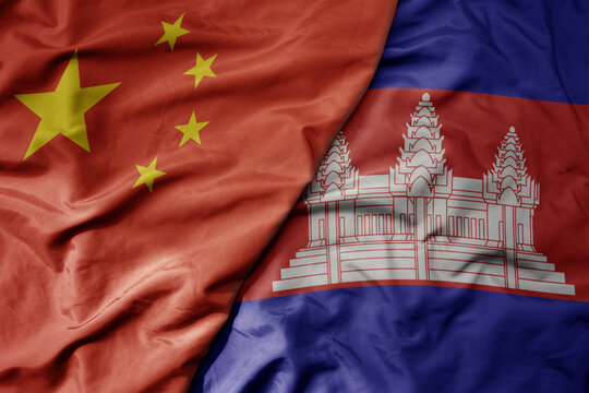 big waving national colorful flag of china and national flag of cambodia .