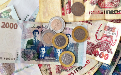 Scattered Algerian banknotes, Algerian dinars in denominations of five dinars, fifty dinars, one...
