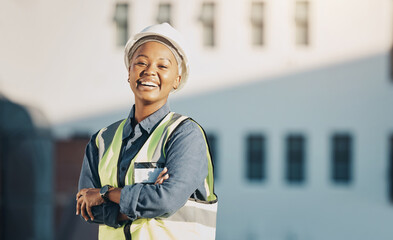 Woman, construction worker and arms crossed portrait with a smile for engineering and building renovation job. Happy and African female employee on a industrial site outdoor for builder project