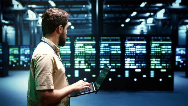 Developer checking event logs and diagnostic tools to identify server issues root cause. Programmer using laptop to check supercomputer operating system configuration settings