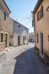 Fototapeta na wymiar Street with old buildings in Lakones village, Corfu, Greece