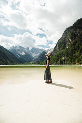 Beautiful female model at Lago di Landro in Italy, the dolomites