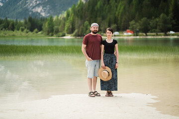 Beautiful traveler in front of lago di landro Italy