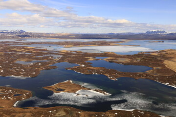 Mývatn is a shallow lake located in an area of active volcanism in northern Iceland, near the Krafla volcano