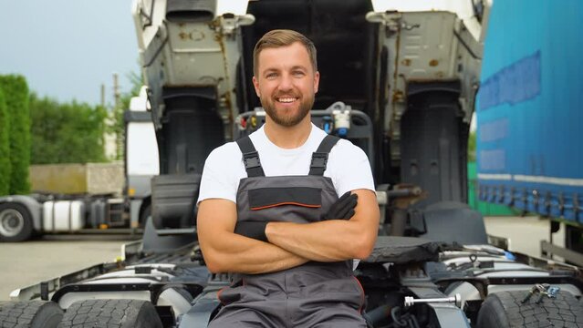 Portrait of professional truck mechanic in auto repair service