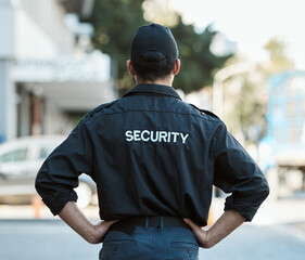 Man, back and security guard in city for safety protection, law enforcement or outdoor emergency....