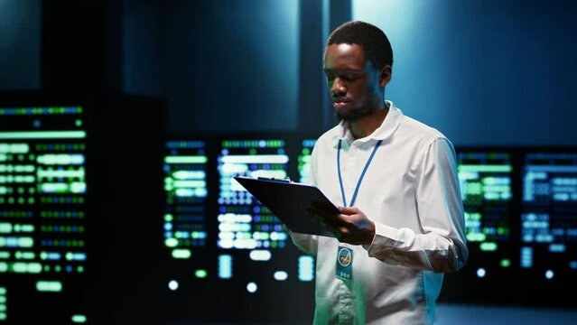 System administrator analysing server clusters performing data backups and providing centralized storage. Expert adjusting Uninterruptible Power Supply ensuring operational continuity