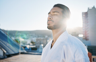 Karate, wellness and breathing with a sports man in the city for self defense training or a combat...