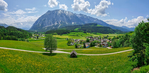 Summer austrian landscape with Grimming mountain (2.351 m), an isolated peak in the Dachstein Mountains, view from small alpine village Tauplitz, Styria, Austria