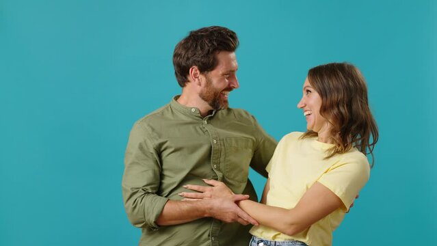 Happy man and woman in love meet and embrace tenderly