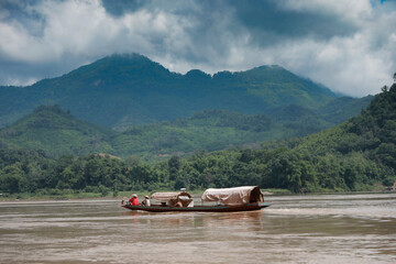 domestic boat sailing in maekong river luang prabang northern of laos