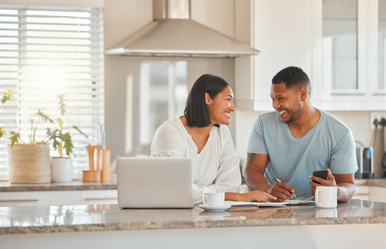 Couple, kitchen and documents for budget, finance and smile with laptop, phone and writing notes in home. Man, woman and paperwork for savings, happy and computer for tax, compliance and investing