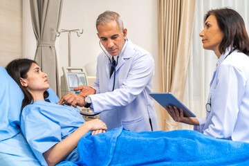 Fototapeta premium Senior man doctor wearing uniform with stethoscope help discussing and consulting talk to sick woman patient checkup information, support, care, diseases, treatment in hospital.healthcare