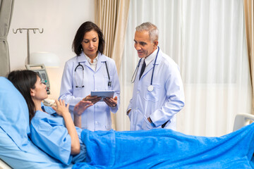 Obraz premium Senior man doctor wearing uniform with stethoscope help discussing and consulting talk to sick woman patient checkup information, support, care, diseases, treatment in hospital.healthcare