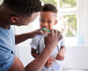 African father, teaching son and toothbrush with care, love or support for cleaning, hygiene or dental wellness. Black man, boy and brushing teeth in home bathroom with health, smile and helping hand