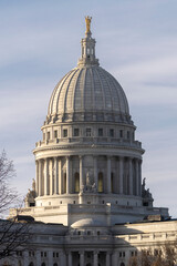 Fototapeta na wymiar Capitol Portrait. The impressive view of the Madison, Wisconsin state capitol building in dwindling light. Stark and robust Neoclassical architecture, a classic United States government building