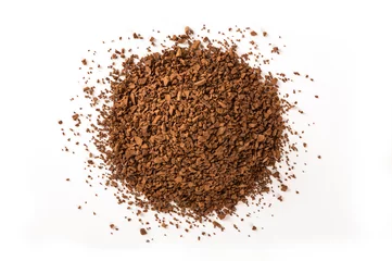 Tuinposter Pile of instant coffee grains on white background. Top view © Suraphol