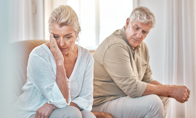 Senior couple, divorce and headache in fight, conflict or argument on the living room sofa at home....
